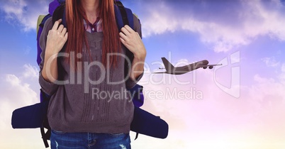 Tourist woman with backpack against airplane in sky