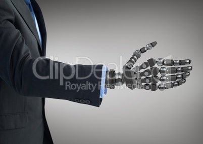 Business man with robot hand against grey background