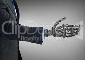 Business man with robot hand against grey background