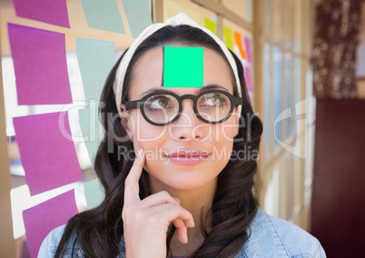 Woman with sticky note on her forehead