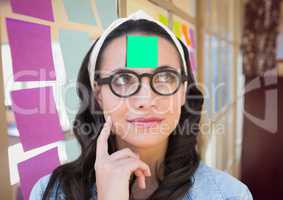 Woman with sticky note on her forehead