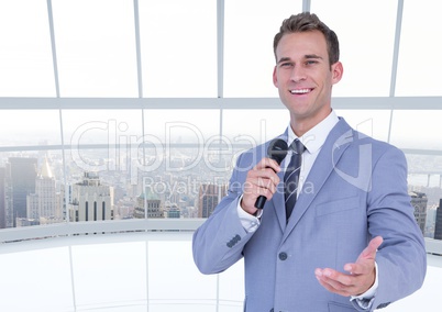 Businessman speaking on microphone