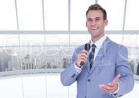 Businessman speaking on microphone