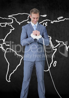 Digital composite image of a bussinessman with hands tied