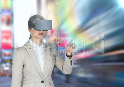 Businesswoman using virtual reality glasses against city in background