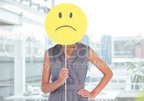 Woman covering her face with sad smiley