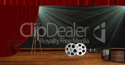 Camera with film reels on stage with red drape curtains