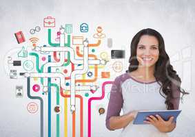 Female executive using digital tablet against application icons