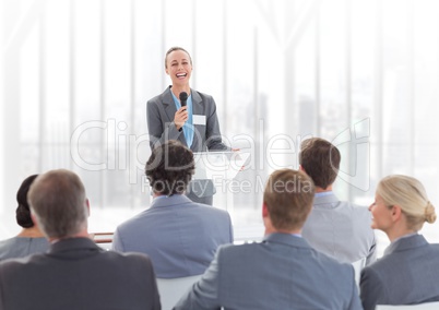 Businesswoman giving a speech in conference hall