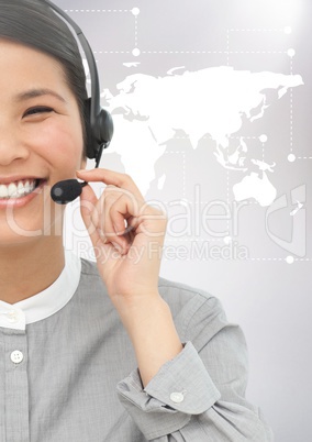 Woman with headphones against digitally generated world map