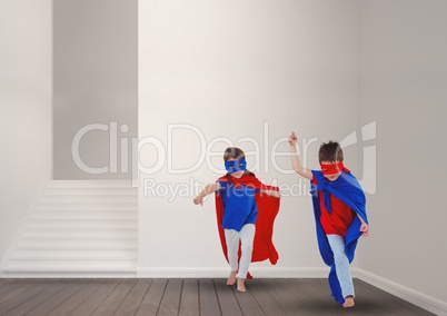 Kids in superhero costume playing at home