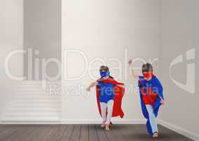 Kids in superhero costume playing at home