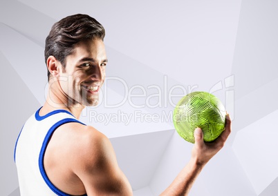 Handsome man holding handball against white background