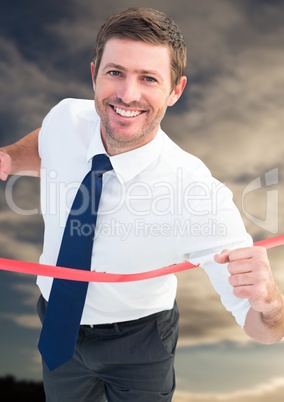 Excited businessman crossing the finish line