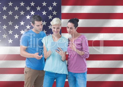 Executives using digital tablet against american flag