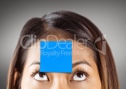 Businessman with sticky note stuck on his forehead