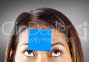 Businessman with sticky note stuck on his forehead