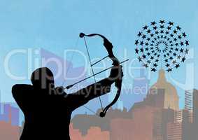 Silhouette of man aiming at the target board against cityscape in background