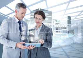 Business executives using digital tablet against digital interface in background