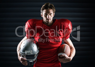 American football player holding rugby ball and helmet against digitally generated background