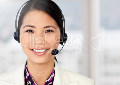 Woman wearing headphones at office