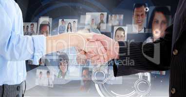 Mid-section of businesspeople shaking hands against interface background