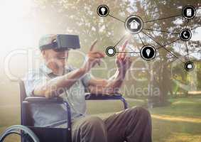 Disabled senior man touching interface screen while using virtual reality headset