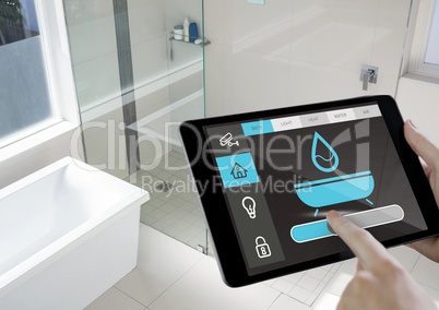 Conceptual image of a man adjusting temperature by using digital tablet