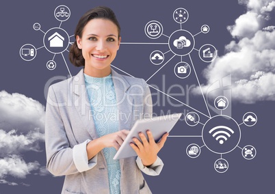 Portrait of a businesswoman using digital tablet with clouds and applications icons in background