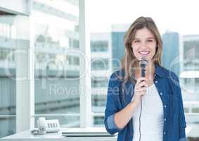 Female executive speaking on microphone