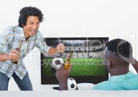 Excited friends watching football match while having beer