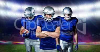 Digital composite image of american football players standing with ball