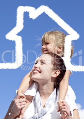 Happy mother carrying her daughter on shoulder on a sunny day
