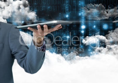 Businessman holding digital tablet against digitally generated background