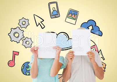 Couple covering their face with placard against yellow background