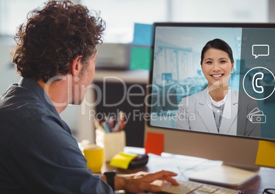 Man having a video call with his colleagues on desktop pc