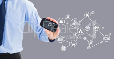 Mid section of man holding mobile phone with connecting icons