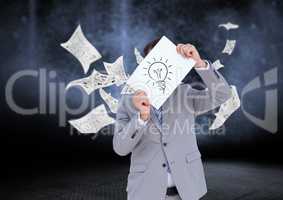 Businessman holding sheet of paper showing a light bulb and documents falling in background
