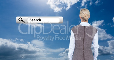 Rear view of business woman looking at search bar icon against cloudy sky