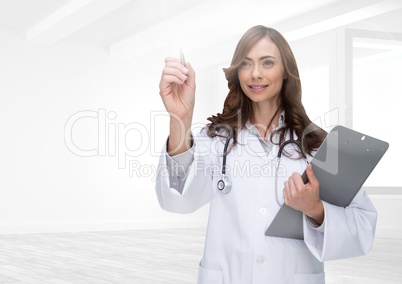 Smiling doctor writing on digital screen
