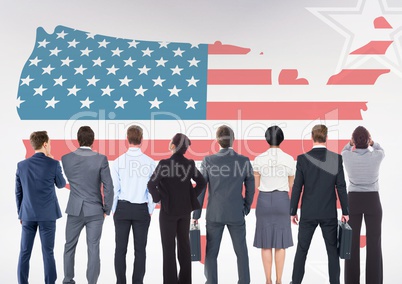 Rear view of business people looking at American flag