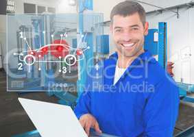 Portrait of a happy automobile mechanic holding laptop