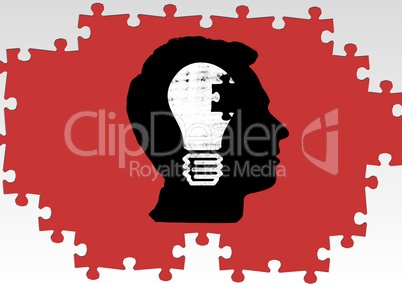 Silhouette of a mans head with a light bulb and jigsaw puzzle