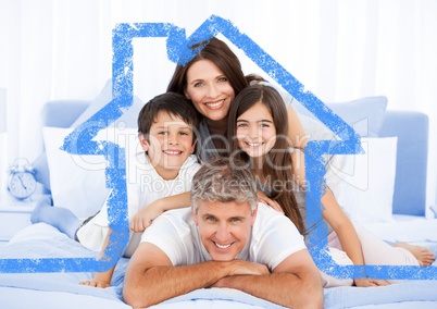 Family on bed together with house outline