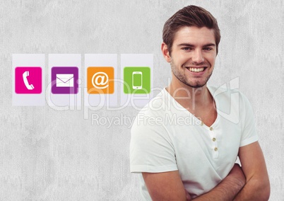 Smiling man standing with arms crossed against various application icons