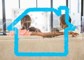 Family sitting on sofa at home against home outline in background