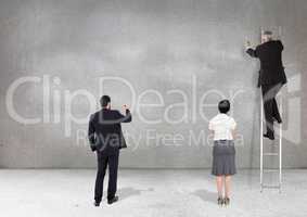 Business professionals drawing on grey background