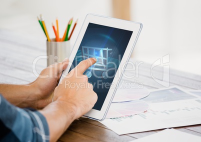 Man touching shopping cart icon on digital tablet