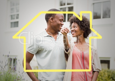 Conceptual image of couple holding keys for their new home