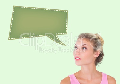 Thoughtful woman with blank tag against green background